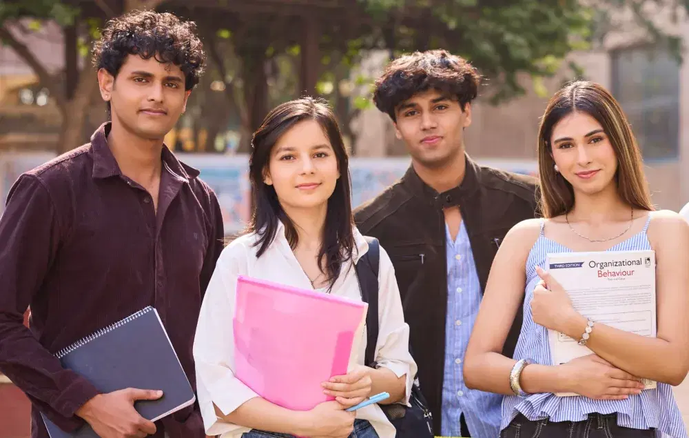 Diverse students engaging in campus life and peer learning at KRMU